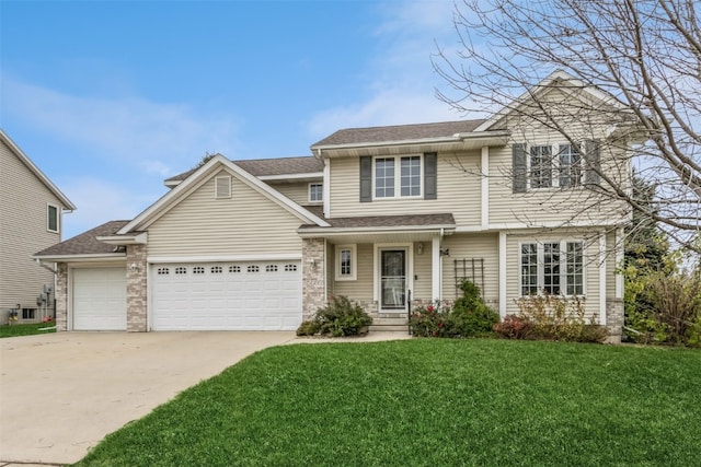 view of property with a front lawn and a garage