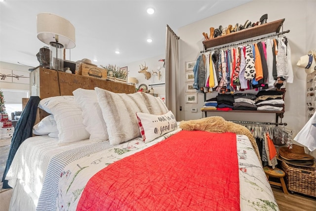 bedroom with hardwood / wood-style flooring