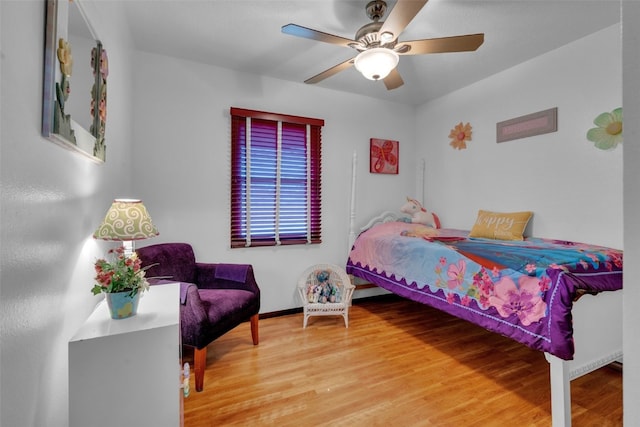 bedroom with hardwood / wood-style flooring and ceiling fan