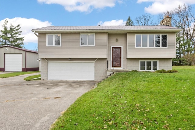 split foyer home featuring a front lawn