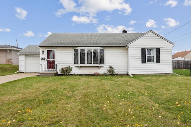 single story home featuring a garage and a front lawn