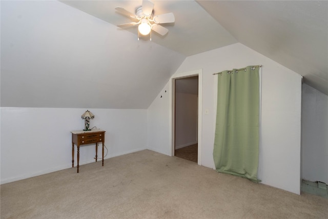 bonus room featuring light colored carpet, vaulted ceiling, and ceiling fan