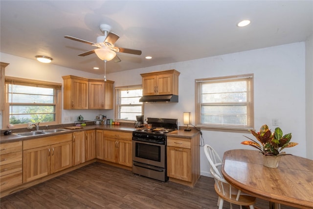 kitchen featuring dark hardwood / wood-style flooring, sink, ceiling fan, and stainless steel range with gas stovetop