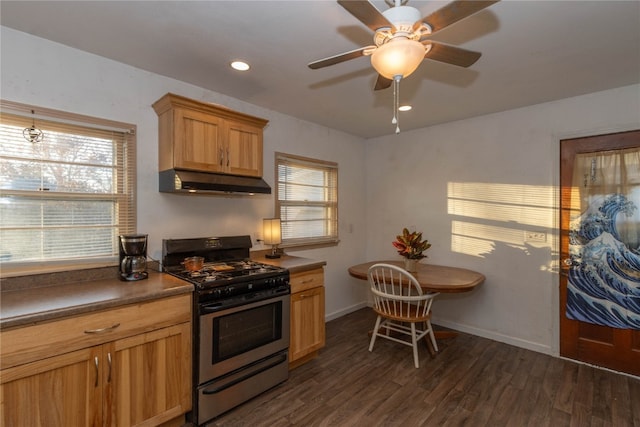 kitchen with ceiling fan, dark hardwood / wood-style flooring, and gas range