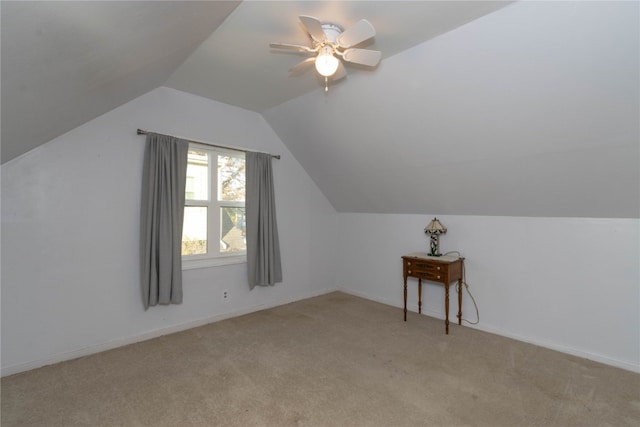 bonus room featuring light carpet, vaulted ceiling, and ceiling fan