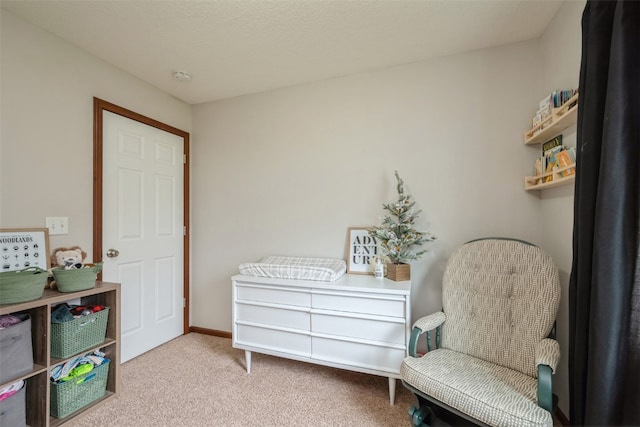 living area featuring light carpet