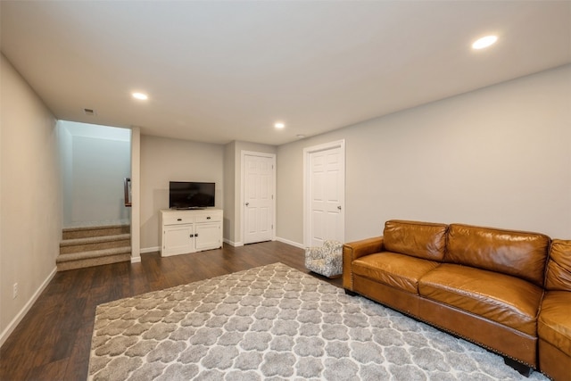 living room with dark hardwood / wood-style floors