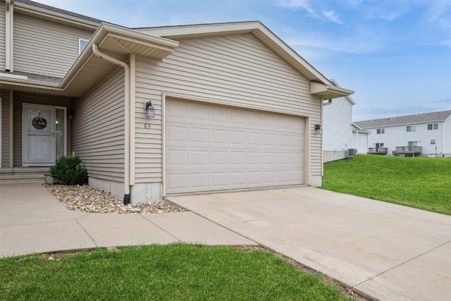 view of property exterior with a lawn, cooling unit, and a garage