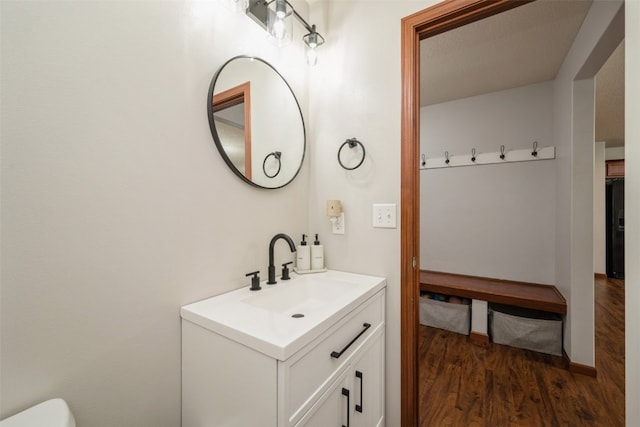 bathroom with vanity and hardwood / wood-style flooring