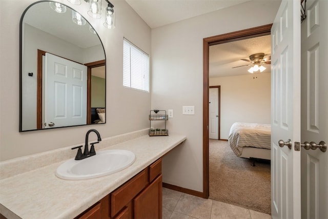 bathroom featuring vanity, tile patterned floors, and ceiling fan