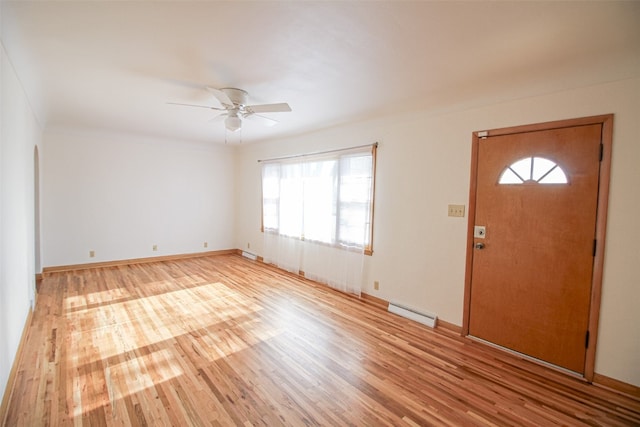 entrance foyer with ceiling fan, plenty of natural light, and light hardwood / wood-style flooring