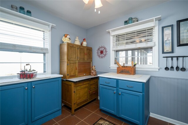 kitchen with ceiling fan and blue cabinets