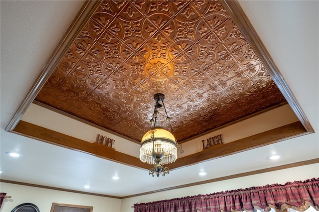 interior details featuring ornamental molding and a notable chandelier