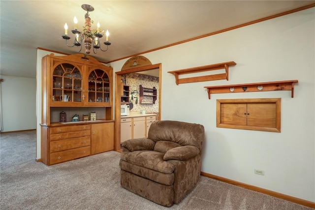 2482 65th St, Vinton, IA 52349 - living area with carpet, a chandelier, baseboards, and crown molding