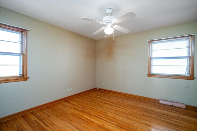 2482 65th St, Vinton, IA 52349 - unfurnished room with healthy amount of natural light, light wood-style flooring, baseboards, and a ceiling fan