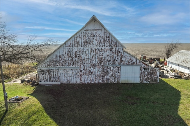 view of outbuilding with a lawn