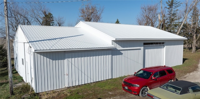 view of property exterior with an outdoor structure