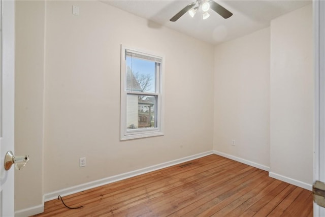 empty room featuring ceiling fan and light wood-type flooring