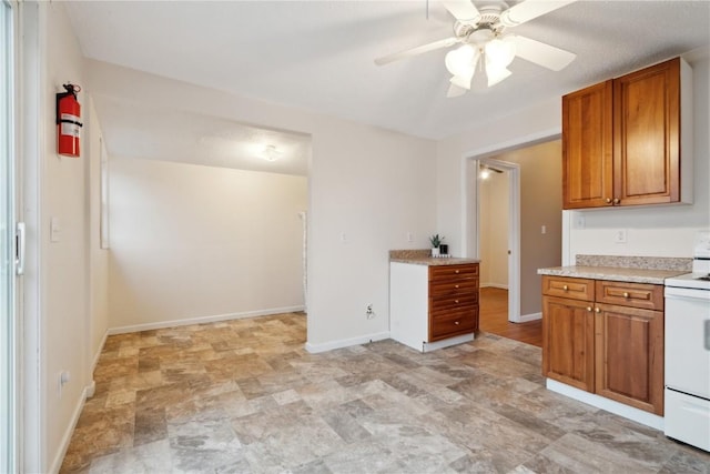 kitchen with white electric range oven and ceiling fan