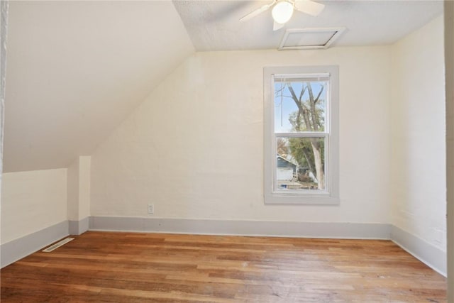 bonus room featuring hardwood / wood-style flooring and vaulted ceiling