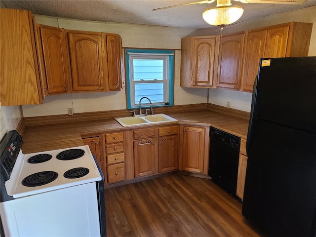 kitchen with a textured ceiling, ceiling fan, dark wood-type flooring, sink, and black appliances