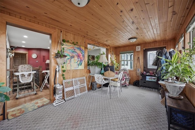 sunroom featuring wood ceiling