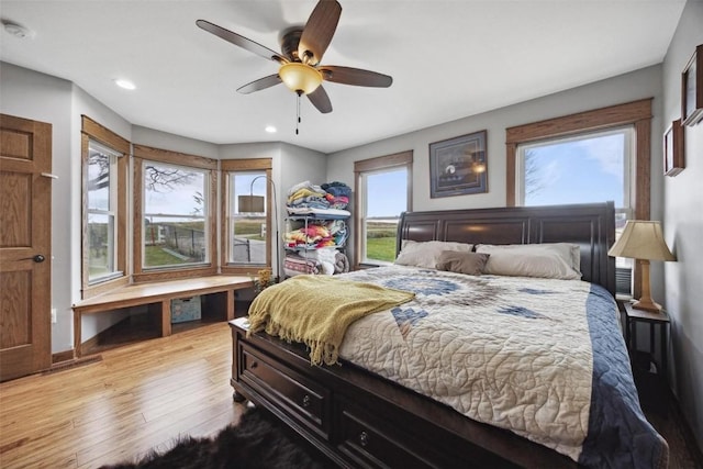 bedroom featuring ceiling fan and light wood-type flooring