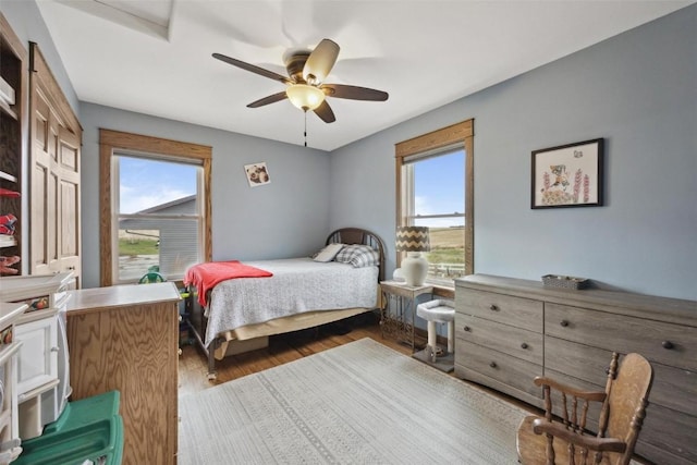 bedroom with wood-type flooring and ceiling fan