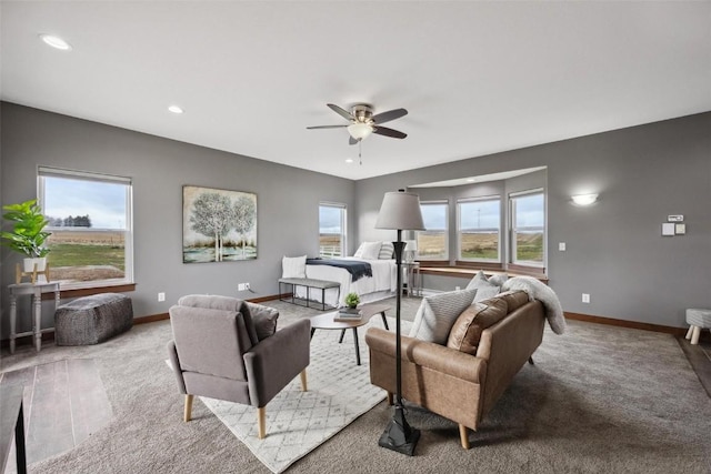 living room featuring light carpet and ceiling fan