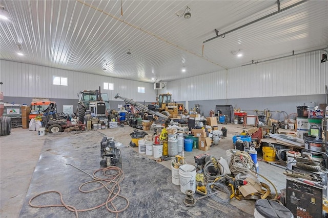 misc room featuring concrete flooring and a workshop area