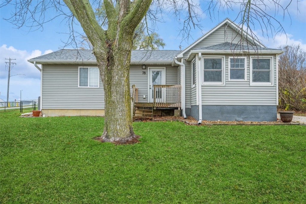 back of house with a yard