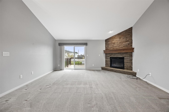 unfurnished living room with light colored carpet, a fireplace, and high vaulted ceiling