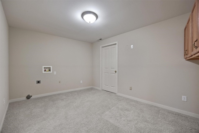 clothes washing area with cabinets, washer hookup, light colored carpet, and hookup for an electric dryer