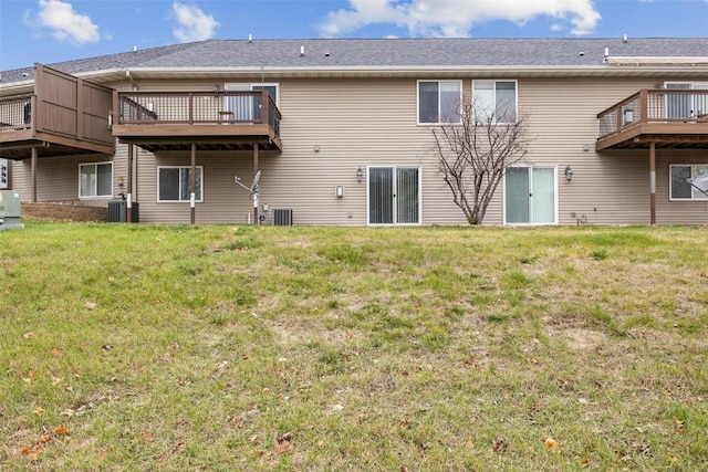 back of property featuring central AC