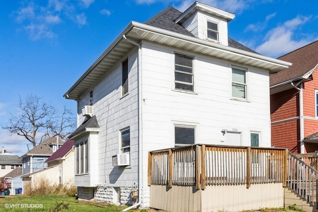 back of property featuring cooling unit and a deck