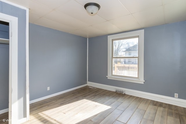 unfurnished bedroom with wood-type flooring