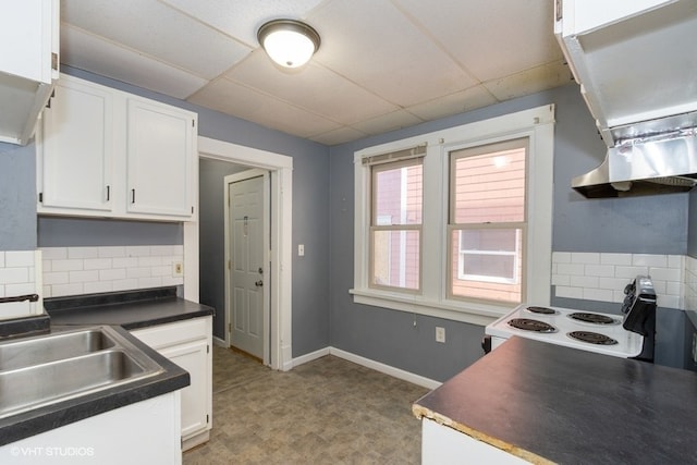 kitchen featuring a paneled ceiling, white cabinets, white electric range, sink, and decorative backsplash