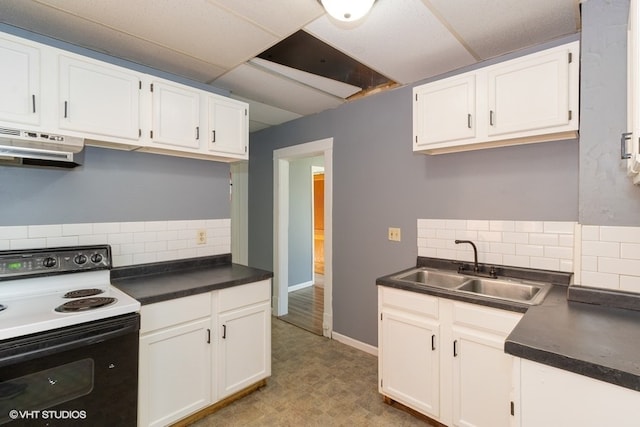 kitchen featuring white electric range oven, decorative backsplash, white cabinets, and extractor fan