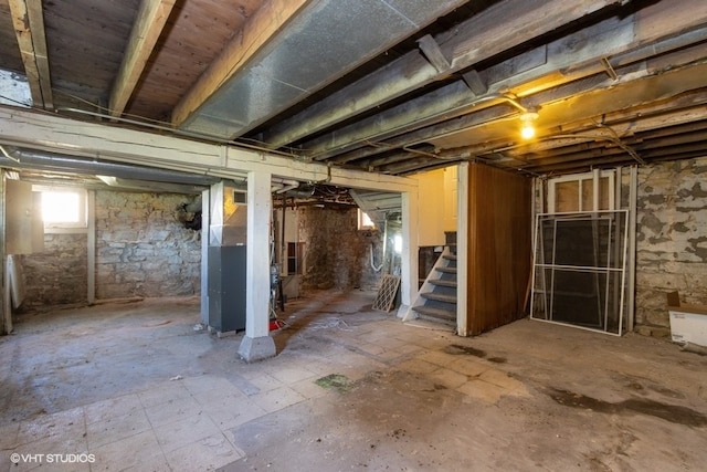 basement featuring heating unit