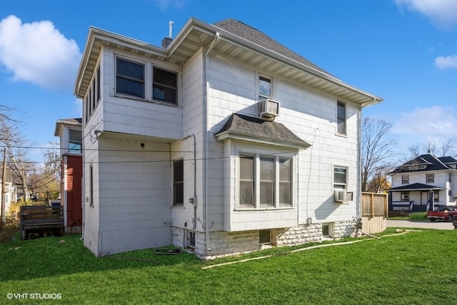 back of house with a yard