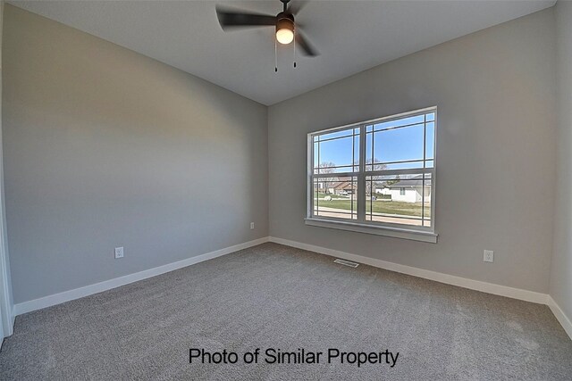 carpeted empty room with ceiling fan