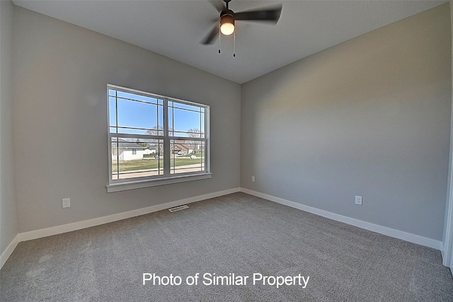 empty room featuring carpet and ceiling fan