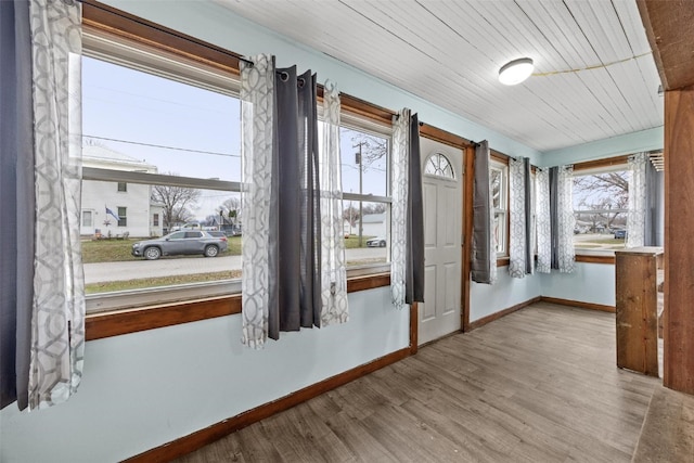 interior space with wooden ceiling and light hardwood / wood-style floors