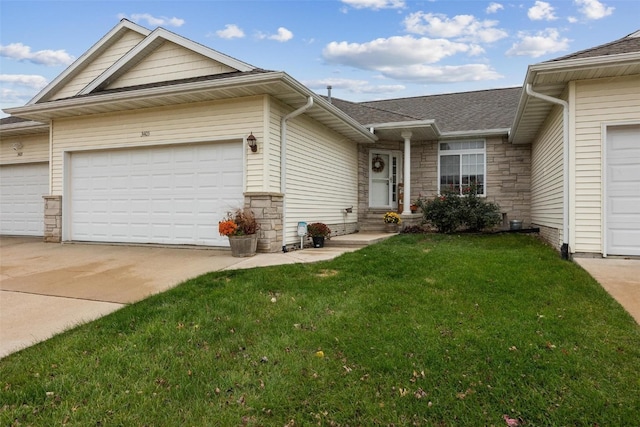 ranch-style home with a front yard and a garage