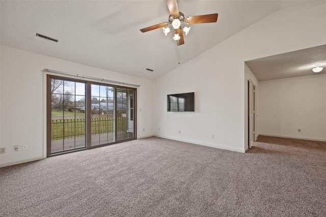 carpeted spare room featuring high vaulted ceiling and ceiling fan