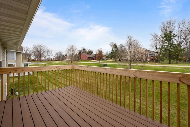 wooden deck with a lawn