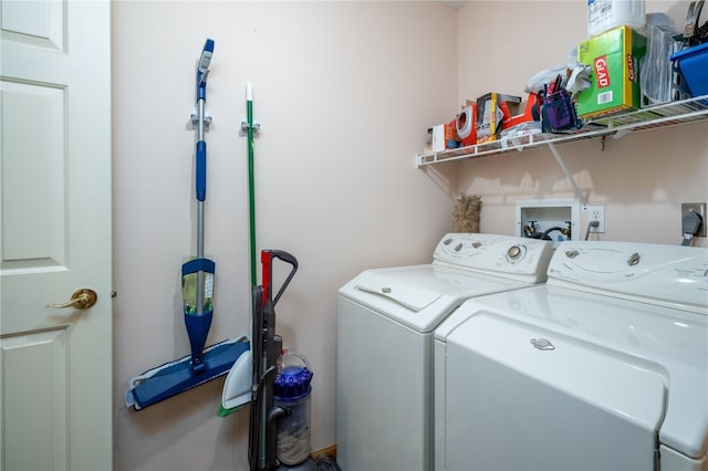 clothes washing area featuring washing machine and clothes dryer