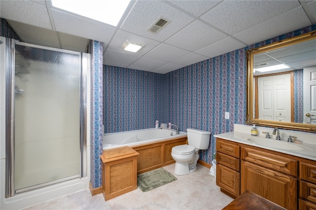 full bathroom featuring vanity, toilet, a drop ceiling, and independent shower and bath