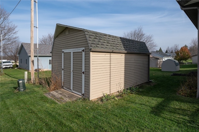 view of outdoor structure featuring a yard