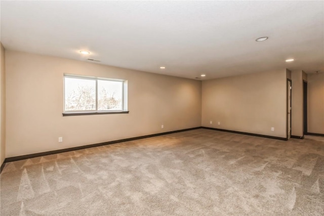 empty room with light colored carpet